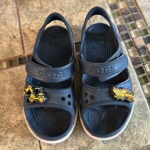 Navy blue crocs with jiblets